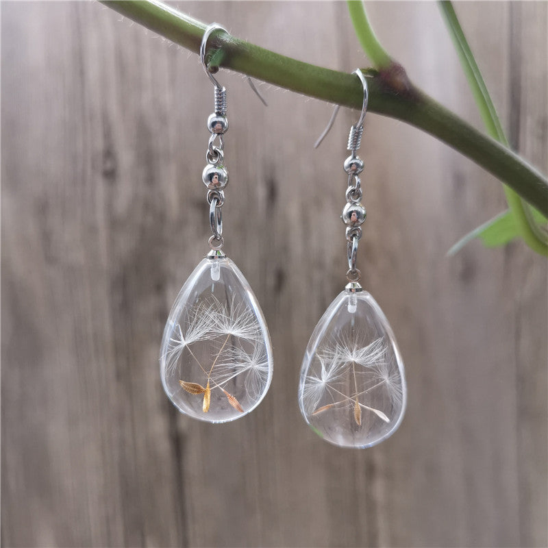 Wholesale  selling resin drop glue dandelion dried flower earrings and the United States dried flower earrings manufacturers